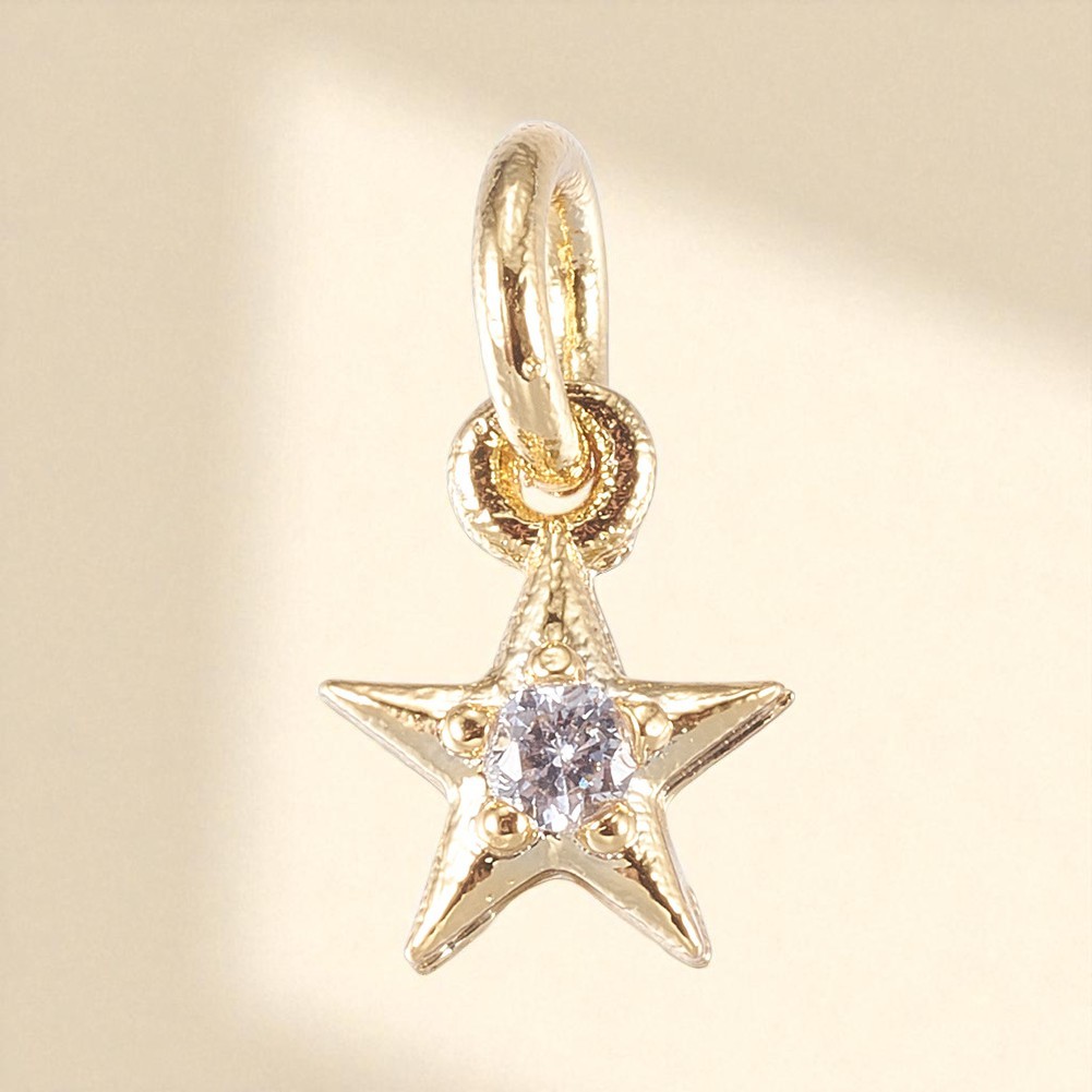 Zierlicher Metallstern Charm Anhänger mit Zirkonia Stein und Biegering 8 x 6 x 2 mm goldfarben Zierlicher Metallstern Charm Anhänger mit Zirkonia Stein und Biegering 8 x 6 x 2 mm goldfarben