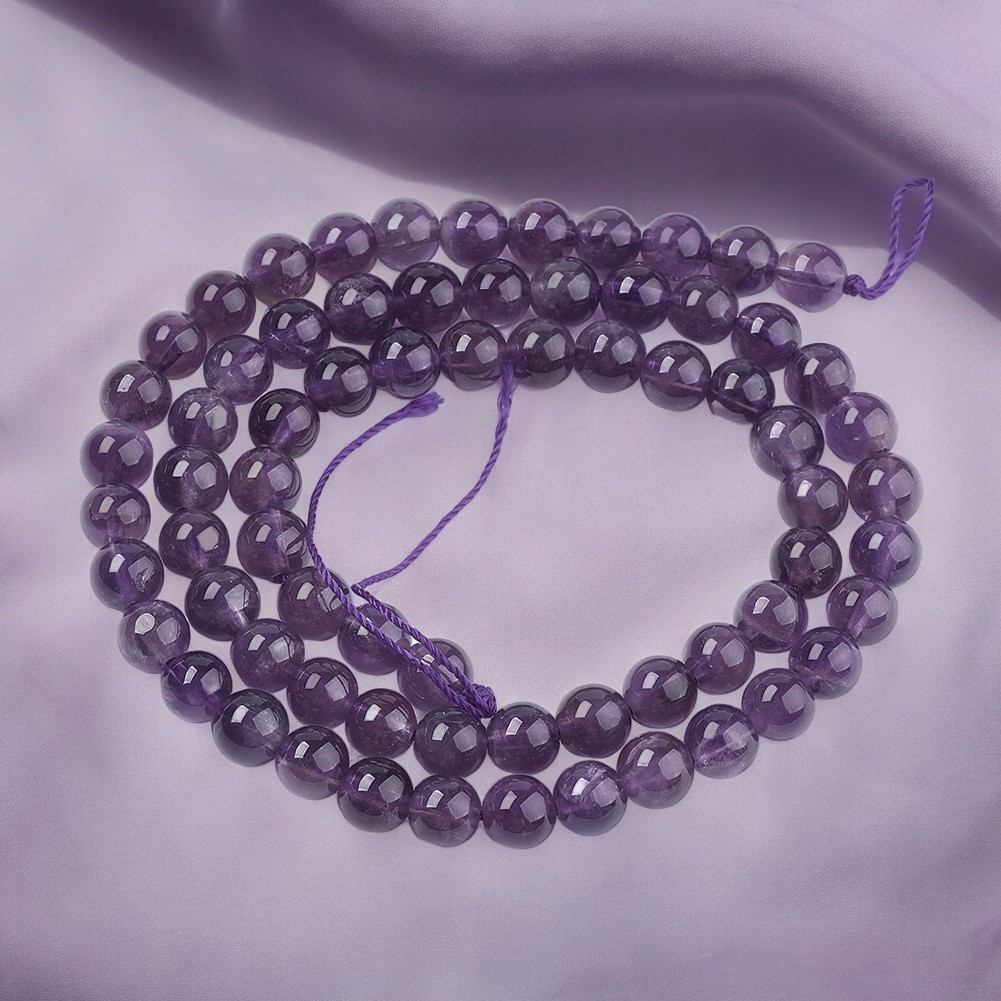 S035B3 Amethyst Perlenstrang 6 - 6,2 mm Klasse AB rund (ca. 66 Perlen / ca. 38 cm Länge)