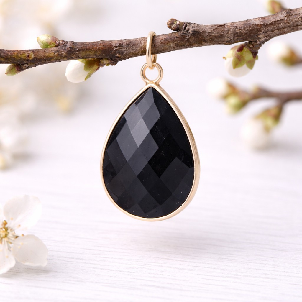 Natürlicher facettierter Obsidian Anhänger mit hell vergoldeter Metalleinfassung 29 x 19 x 7 mm