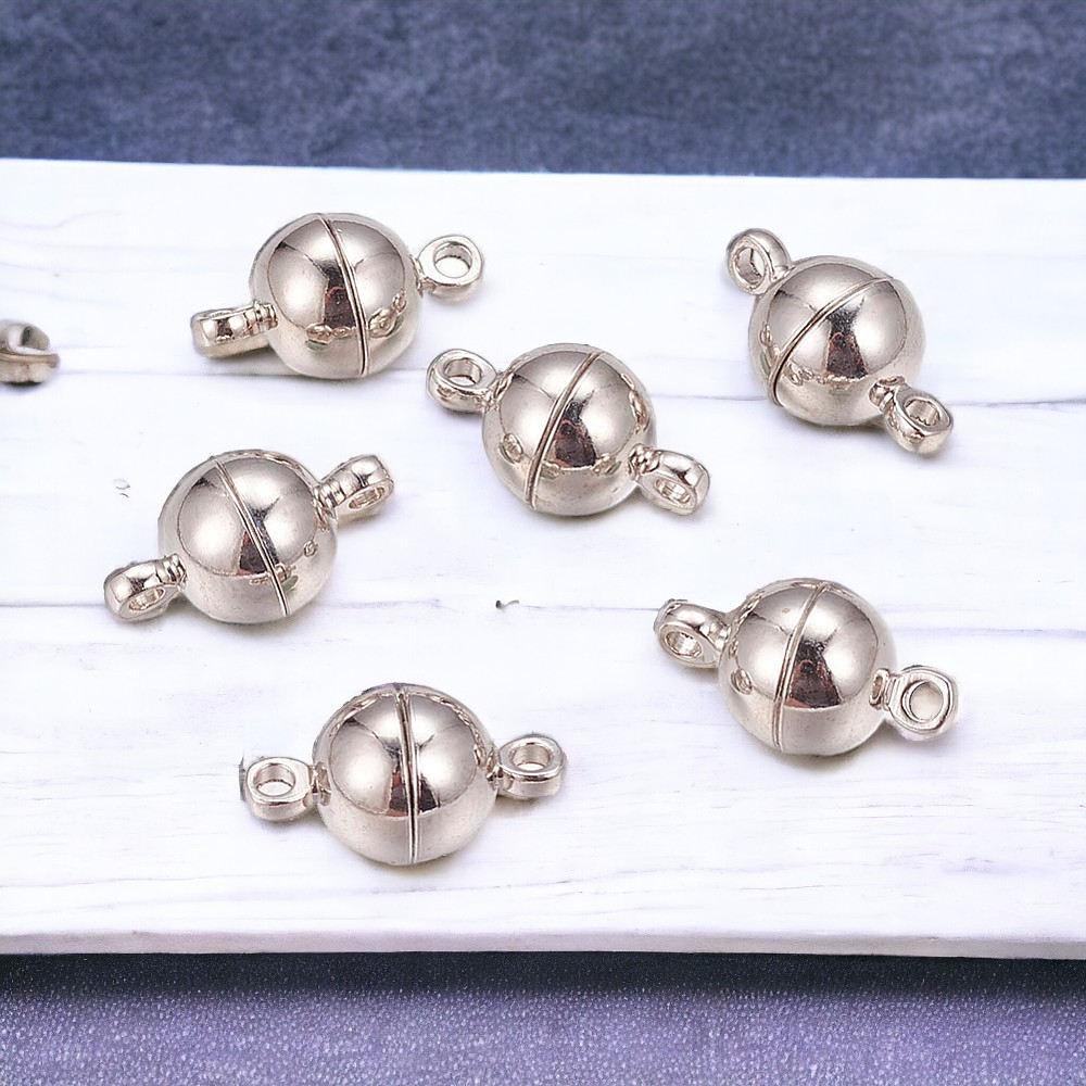 s058b2 2 runde starke Magnetverschlüsse platinfarben 14 x 8 mm