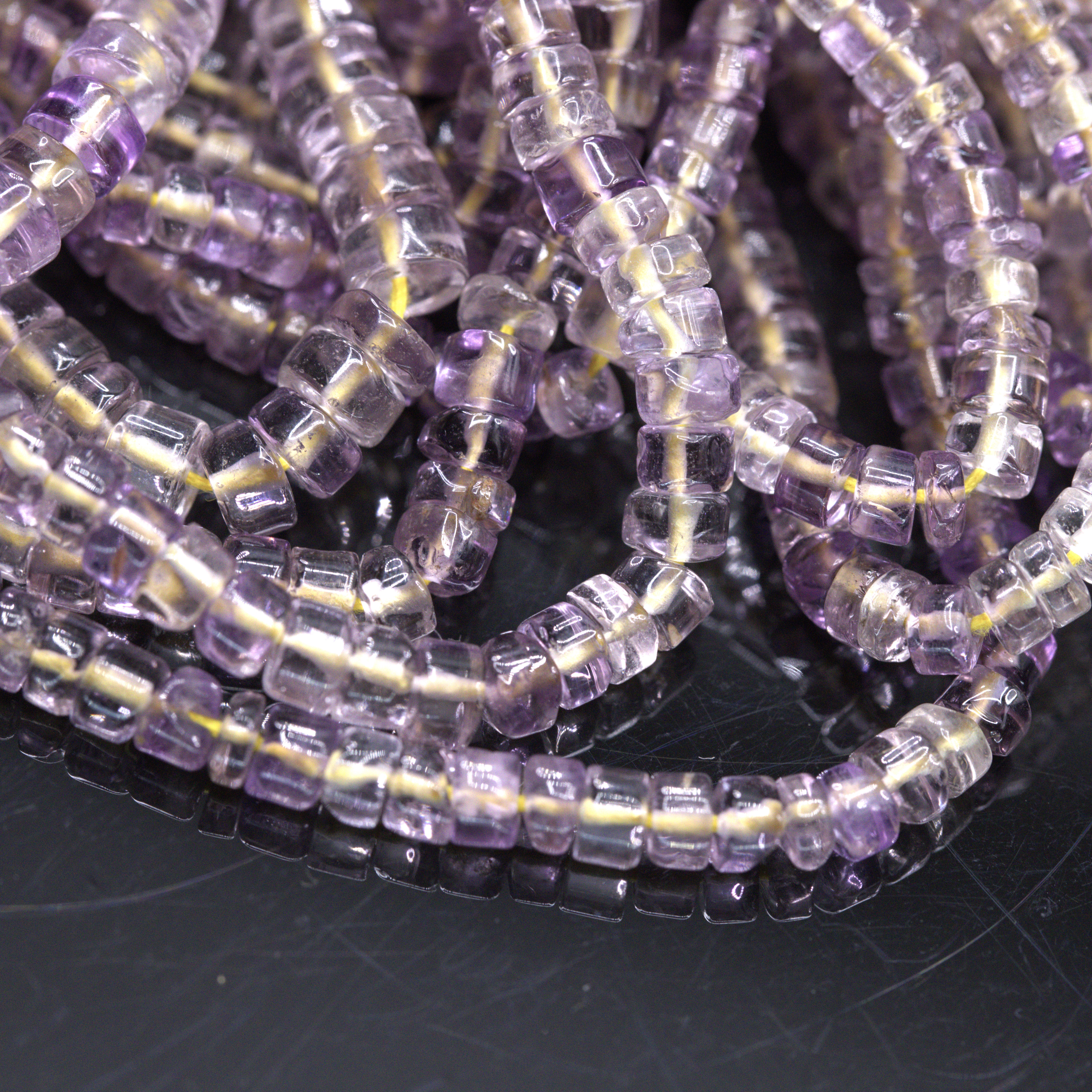 SI1133 Sehr heller Amethyst Perlenstrang 4-5 x 3-4 mm unregelmäßige Rondelle (ca. 36 cm Länge)